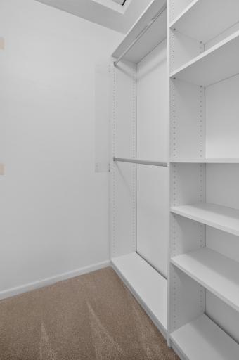 Generous walk-in primary closet provides excellent storage and organization.