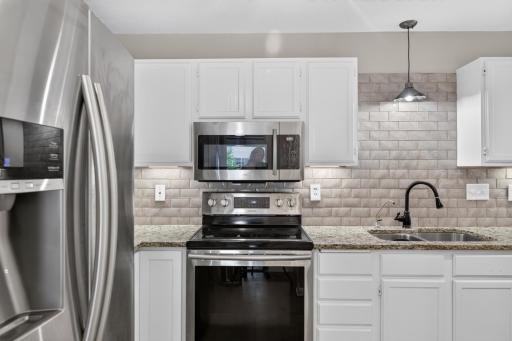 Functional kitchen layout with custom California Closets shelving for additional organization and storage.