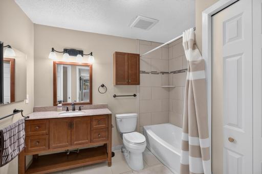 Walk-through full bathroom offers convenient access from the primary bedroom.