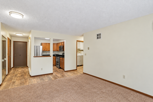 Kitchen opens to living room.