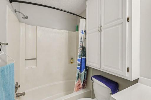Large bathroom with added storage.