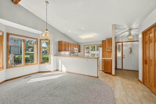 Open concept floor plan with vaulted beamed ceiling