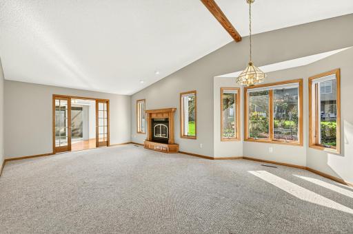 Spacious living room with green views to side