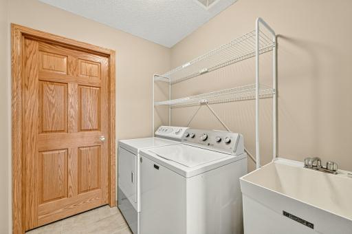 Main floor laundry/mudroom with laundry sink