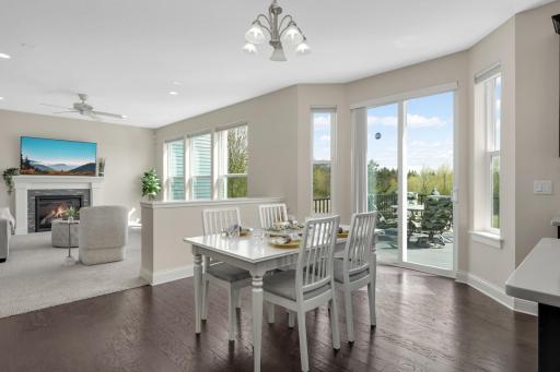 Dining area with walkout to deck and beautiful views, connected to open living space.
