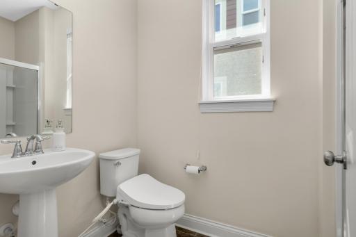 Convenient main-floor ¾ bath with shower, perfect for guests or main-level bedroom use.