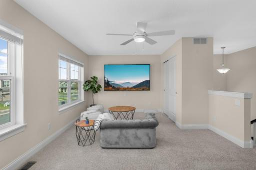 Spacious upper-level loft with natural light—perfect for a second living area, office, or playroom.
