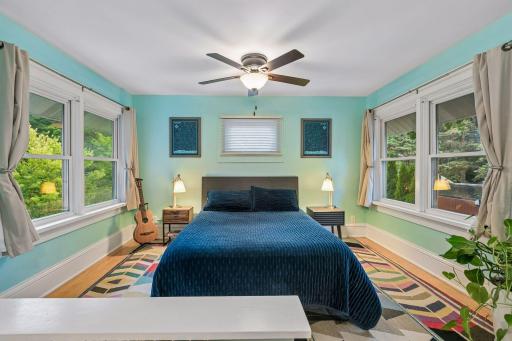The upper level offers four bedrooms, including a large primary bedroom.