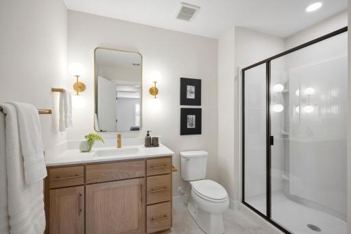 Finished lower level with 5th bedroom and bath. ***Prices, square footage, Photos &/or illustrations do not depict actual home plan configuration. Materials/finishes shown contain options not included