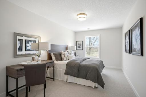 A spacious 5th bedroom at lower level near 3/4 bathroom. ***Prices, square footage, Photos &/or illustrations do not depict actual home plan configuration. Materials/finishes shown contain options not included