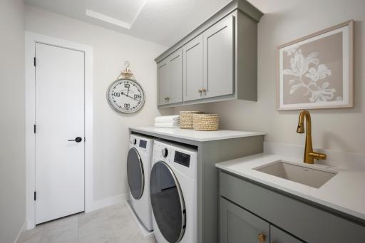Enjoy the Convenience of the 2nd floor laundry room near the bedrooms, and Features custom upper cabinets, beautiful sink, storage! and Linen Closet!