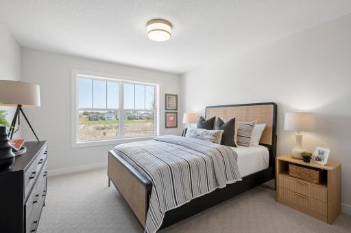 One of 5 bedrooms, plus 2nd floor bonus room above garage, and finished lower level with walkout. ***Prices, square footage, Photos &/or illustrations do not depict actual home plan configuration. Materials/finishes shown contain options not included