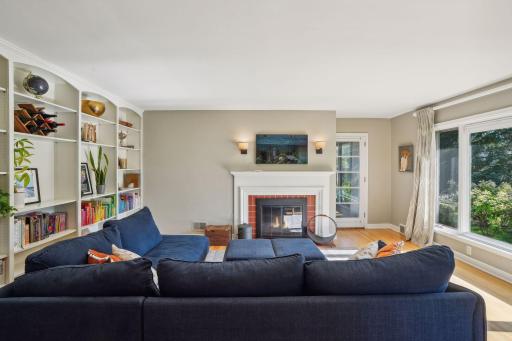 Move in ready with neutral touches throughout. Gleaming hardwood floors, large living room windows fills this space with natural light. Cozy, fireplace and built-in shelving.