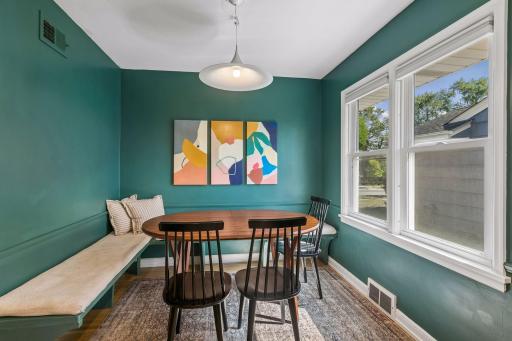 Informal dining is perfect setting for casual dining. Stylish, modern banquette space with large window filling the kitchen space with an abundance of natural light.