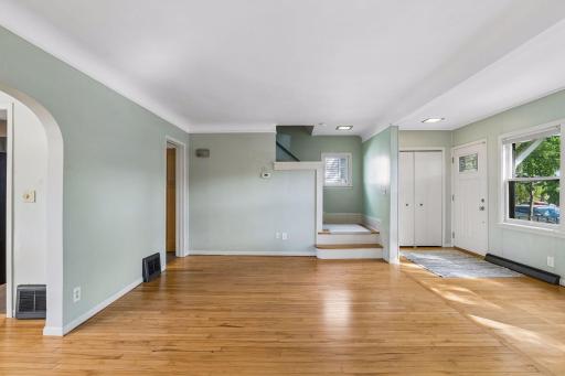 Living room with stair case to upper level