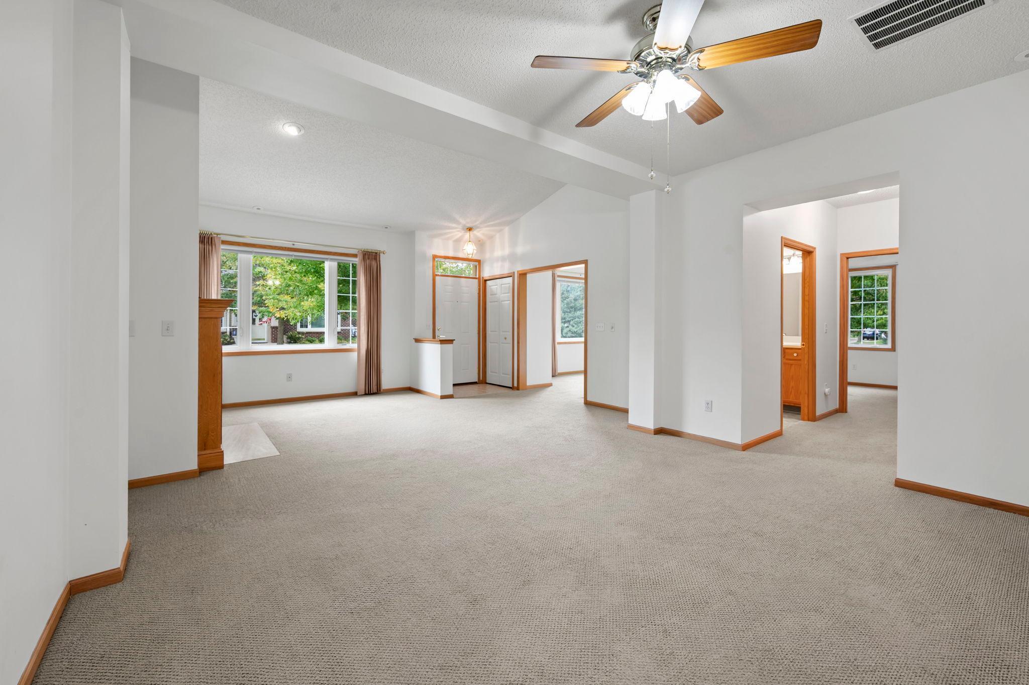 New carpet and neutral paint create a clean, inviting backdrop, while the open-concept layout offers a versatile space to make your own.