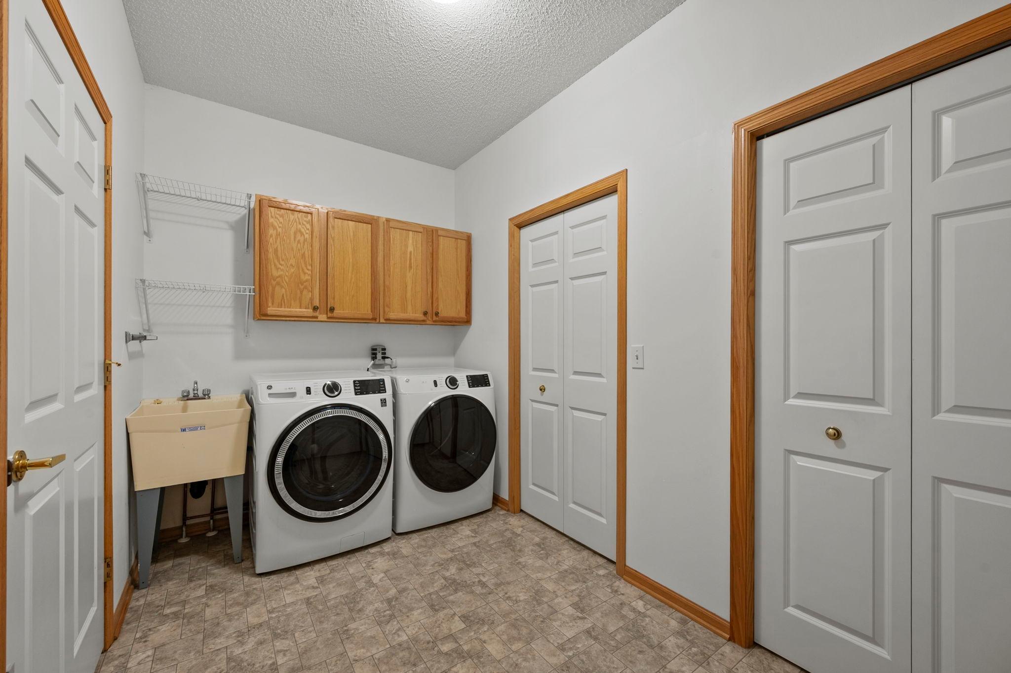 The home features a new washer and dryer, along with a wash tub, cabinet storage, and a dedicated closet for the mechanicals.