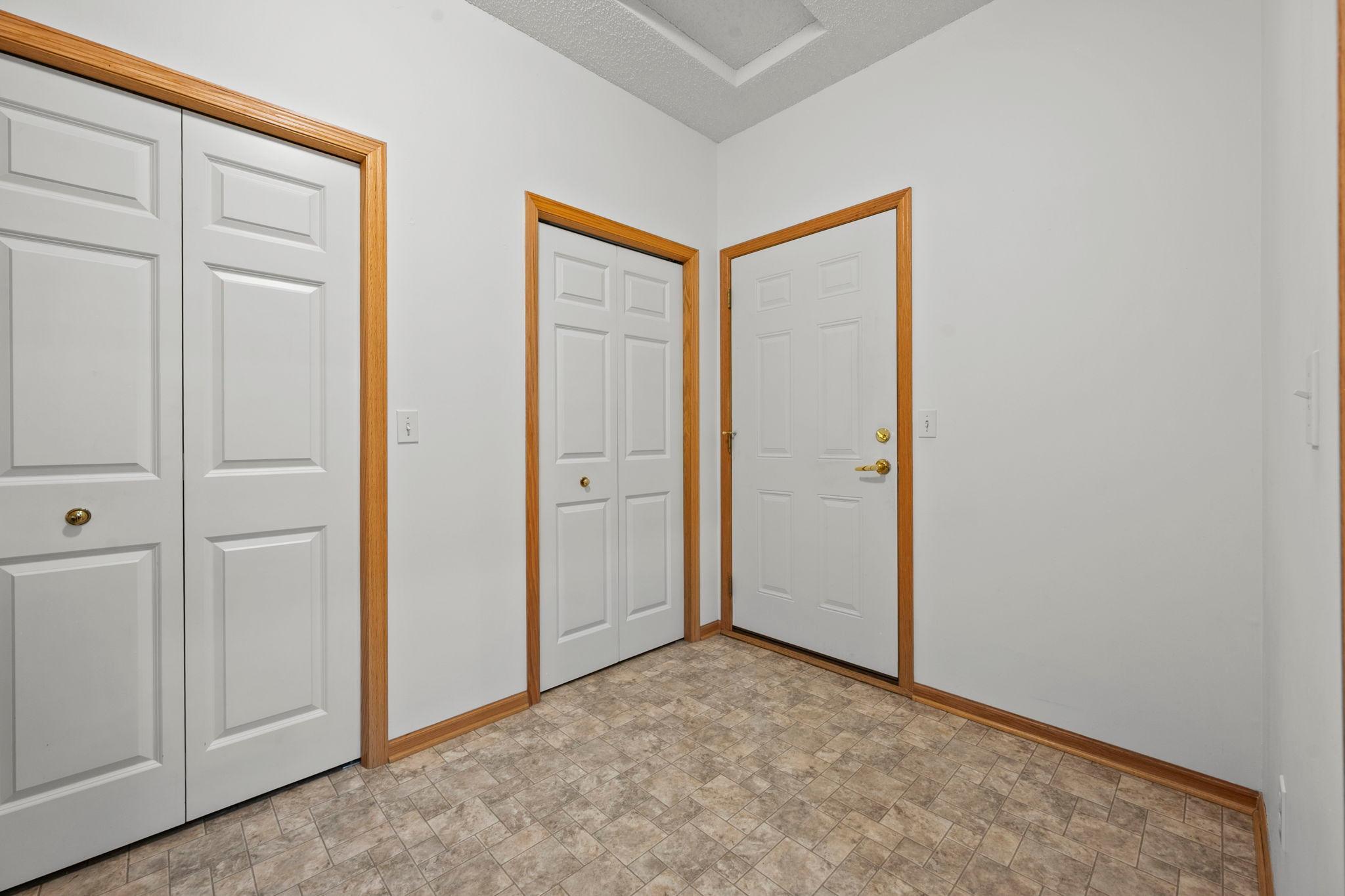 The large mudroom is conveniently located off the garage, with a closet for coats and everyday essentials as you come inside.