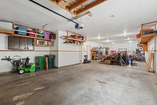 Garage has shelving and its OWN furnace!