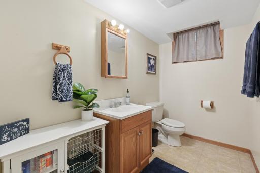 This half bath shares a wall with the utility room for possible future expansion for a shower.