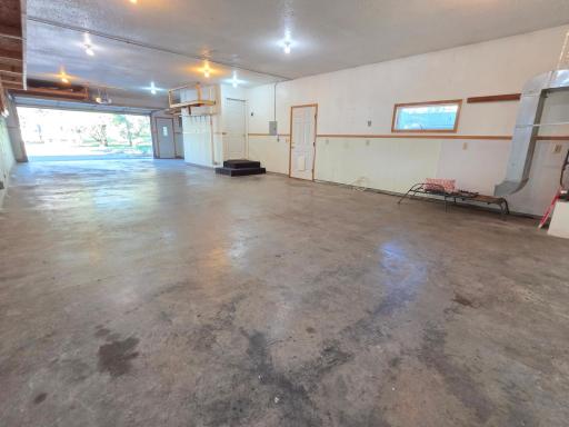 View from back of garage. The side door/entry door is about the half-way point! 52 feet front to back! Can nearly fit 6 cars!