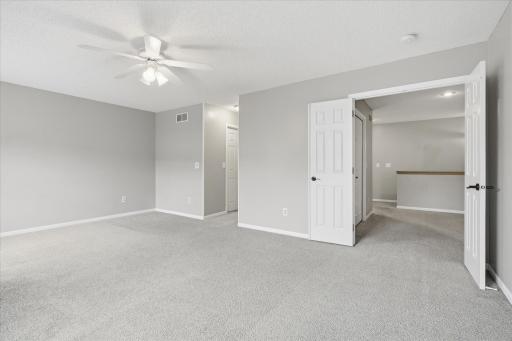 Elegant double-door entry from the hallway welcomes you into the spacious primary suite, creating a grand and private retreat feel.
