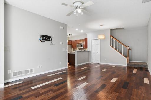 Open-concept main level seamlessly connecting the living room, dining area, and kitchen for comfortable modern living.