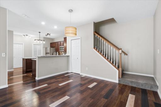 Dining area conveniently located off the kitchen with updated lighting and direct access to the upper level.