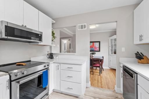 The kitchen is filled with updated appliances, cabinetry, and flooring.