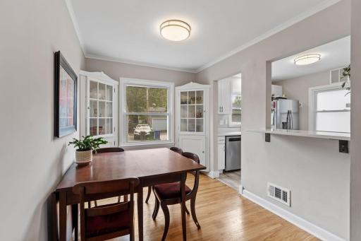 In the dining room you will find charming built-ins, room for your dining table, and barstools if you wish!
