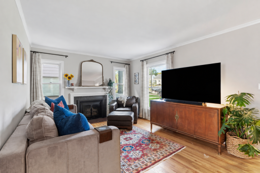 Step inside the sun-filled living room, with hardwood floors throughout the main level.
