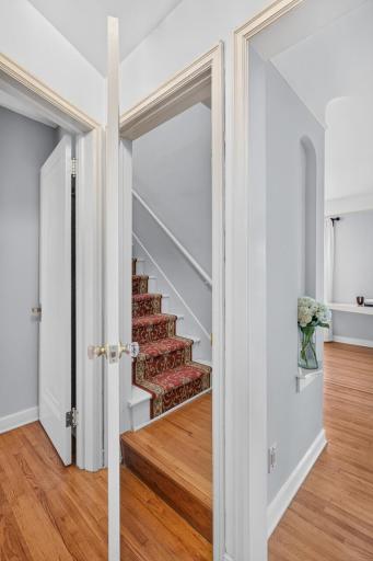 The upper level opens to a private primary suite.