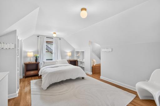 The spacious upper-level primary suite feels bright, comfortable and private.