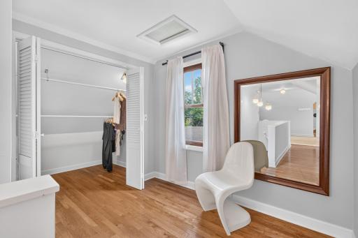 The primary suite also includes a huge walk-in lighted closet with a seating area overlooking the scenic backyard.