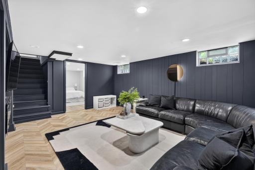 A spacious second gathering area with stylish finishes and plenty of room to relax.