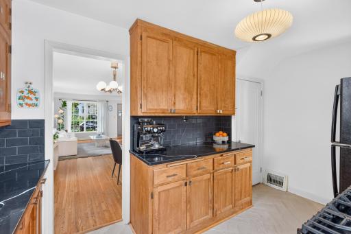 Updated countertops, backsplash, flooring and lighting give the kitchen a refreshed look.