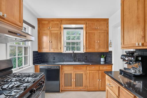 The updated kitchen preserves the charm of the home’s original character while adding sleek finishes.