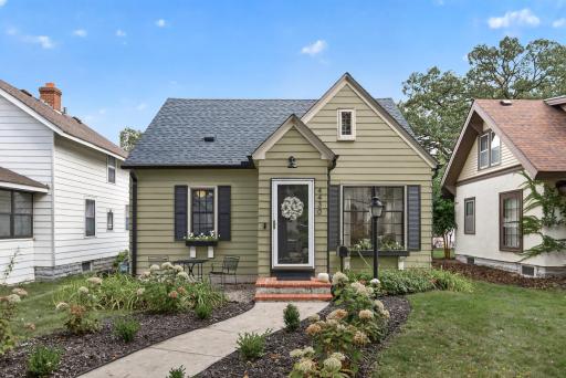 Welcome to 4430 Oliver Ave N, a charming home filled with character, thoughtful updates and beautiful landscaping.