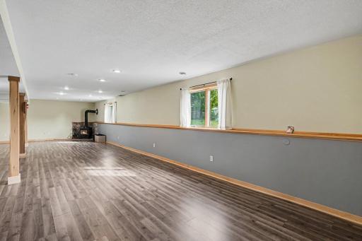Finished basement with wood burner for suplimental heat
