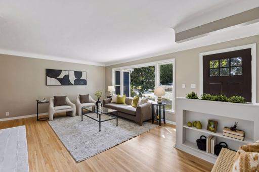 Beautiful living room with a large picture window overlooking the front yard.