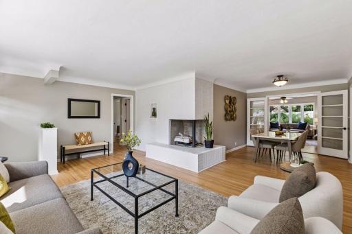 There is a large two sided fireplace with gas log insert on the main floor.