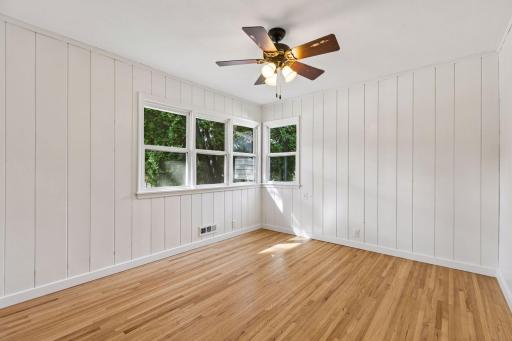 Nice third bedroom with enameled knotty pine.