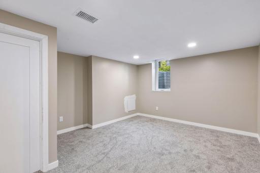 New lower level fourth bedroom with egress window.