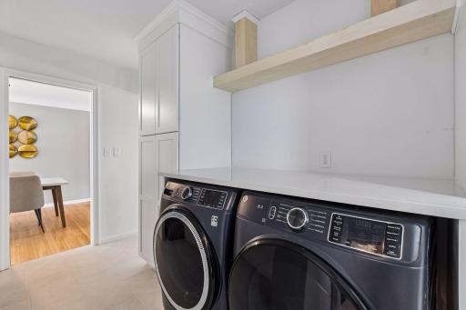The previous kitchen was moved to the family room and the space was converted to a laundry/mud room.