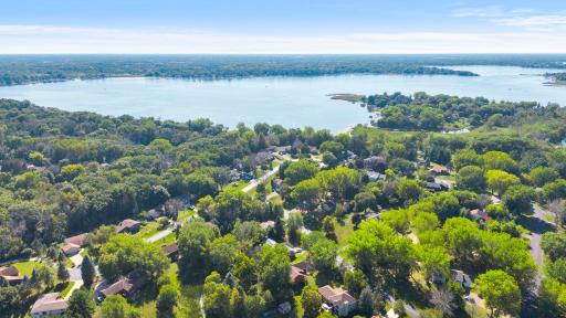 Home is approximately a half mile from the public boat launch on lake three of Forest Lake.