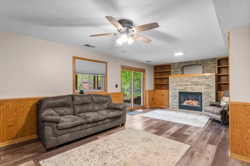 Patio door access to backyard patio from lower level, fireplace with built ins for extra storage