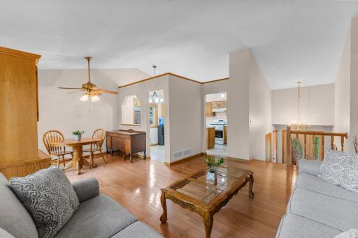 Upper level family room, with view to vaulted ceilings and dining area and eat in kitchen