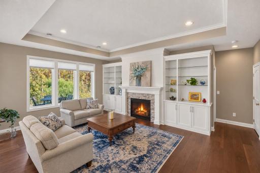 Large windows overlooking wooded backyard