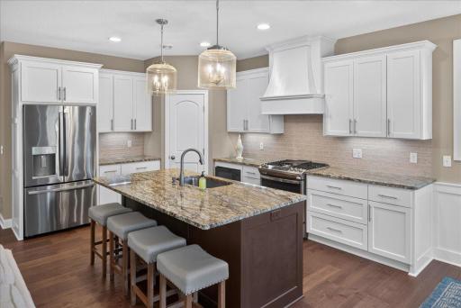 Large granite island with stainless steel appliances
