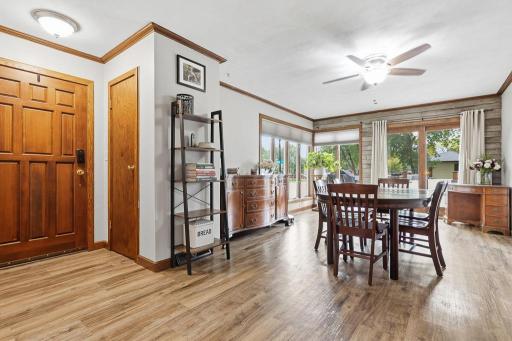 Front door entryway with coat closet and formal dining room with patio door access to the maintenance free deck